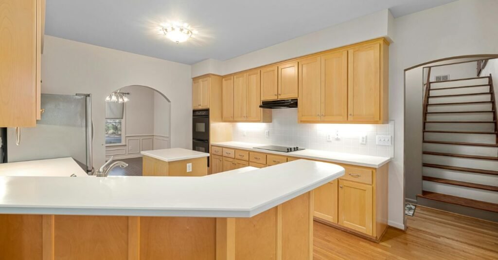 Different types of wood used for kitchen cabinets, including oak, maple, and cherry.