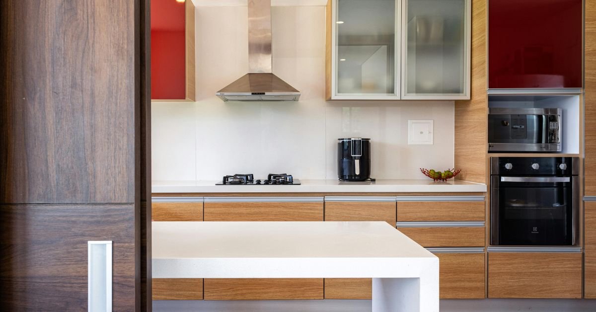 Walnut wood cabinets adding warmth to a kitchen.