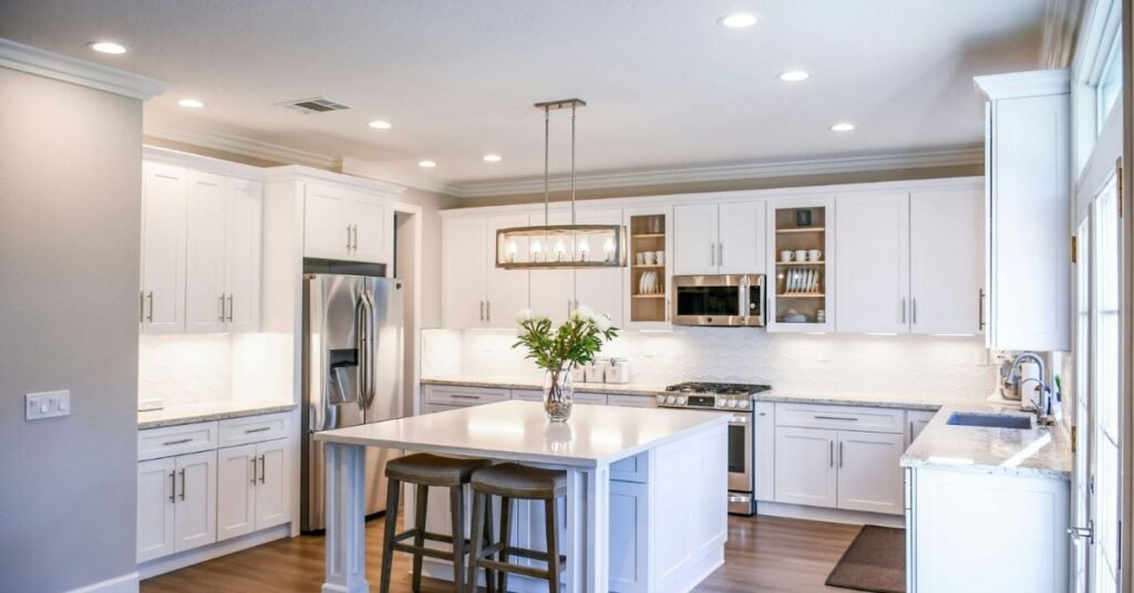 White oak kitchen cabinets with sleek handles and a modern finish.